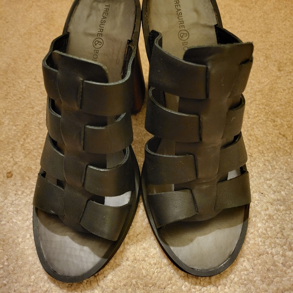 New black sandal with wooden heels.  Size 5.5